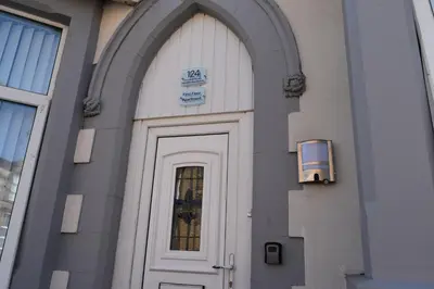 a door of a building with a sign above it at Adelaide Apartments 2 in Blackpool