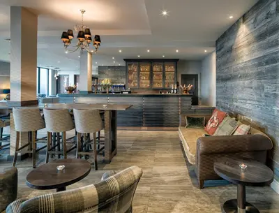 a living room with a couch and a table at Boulevard Hotel in Blackpool