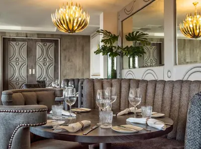 a dining room with a table and chairs at Boulevard Hotel in Blackpool
