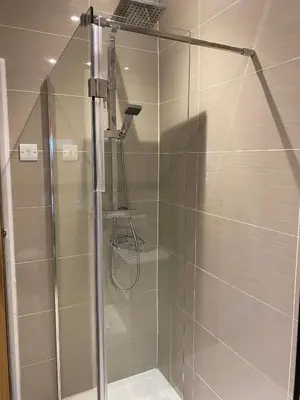 a shower with a glass door in a bathroom at 39 Cowley Road in Liverpool