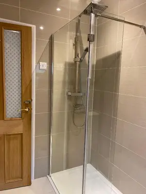 a bathroom with a shower with a glass door at 39 Cowley Road in Liverpool