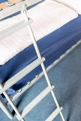 a hospital bed with a blue mattress at Sandpiper Holiday Apartments in Blackpool