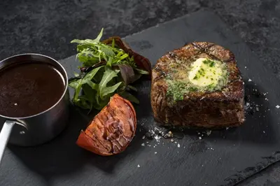 a plate of food with a steak and a salad at Miller & Carter Aughton by Innkeeper's Collection in Ormskirk