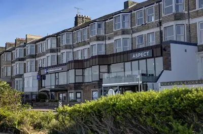 an apartment building with a sign that reads aaser at Best Western Lancaster Morecambe Lothersdale Hotel in Morecambe
