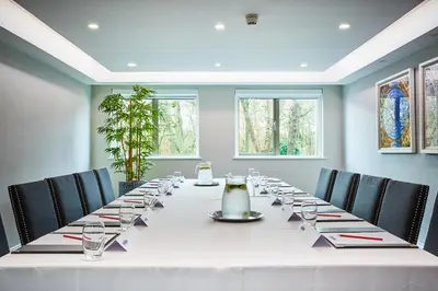 a long table in a room with chairs at Wrightington Hotel, Health Club & Spa in Wigan