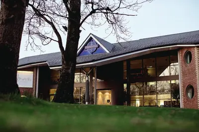 a building with a tree in front of it at Wrightington Hotel, Health Club & Spa in Wigan