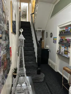 a staircase with a model of the eiffel tower at Hornby Villa B&B Couples & Families Only- Quiet Central Location- Near To Winter Gardens in Blackpool