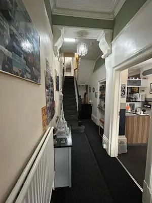 a hallway with a staircase and a stair case at Hornby Villa B&B Couples & Families Only- Quiet Central Location- Near To Winter Gardens in Blackpool