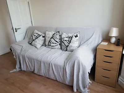 a bed with four pillows on it in a room at Central Location Preston 2 in Preston