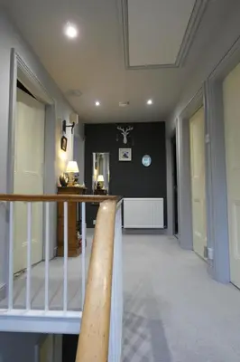 a hallway with a baseball bat on a balcony at Kentwood Guest House in Arnside