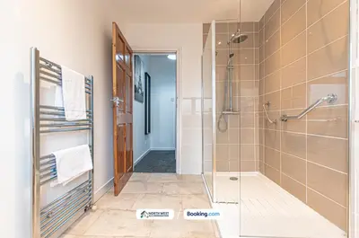 a bathroom with a shower and a walk in shower at Wigan Work-Ready 3BR House Sleeps 6 Guests in Wigan