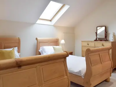 a bedroom with a bed and a skylight at The Old Dairy - Ukc3413 in Bolton by Bowland