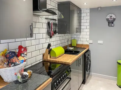 a kitchen with a sink and a counter top at Jasmin's Retreat in Cleveleys