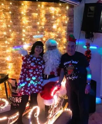 a man and a woman standing in front of a snowman at The Melville Hotel - Central Location in Blackpool
