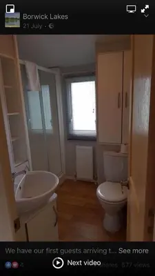 a bathroom with a sink and a toilet at Carmels Caravan Borwick Lakes in Carnforth