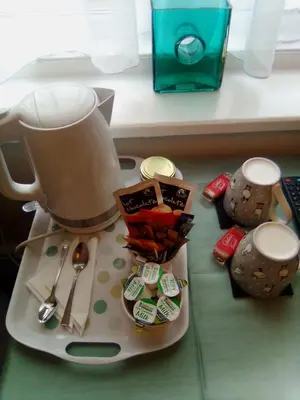 a mixer sitting on a counter next to a table at The braeside families and couples in Blackpool