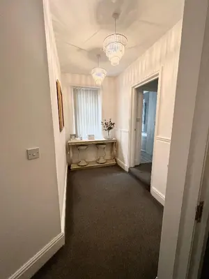 a hallway with a hallway leading to a room at Large Luxury Apartment Blackpool in Blackpool