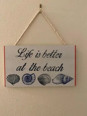 a sign that reads life is better at the beach at The Hurstmere in Blackpool