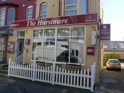 a building with a white fence in front of it at The Hurstmere in Blackpool