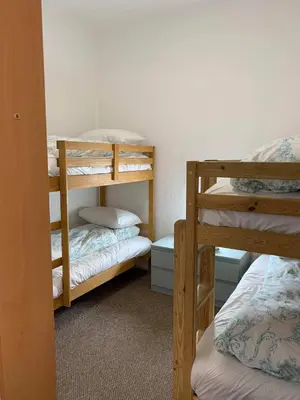 a room with two bunk beds and a room with at Danescourt Lodge in Blackpool