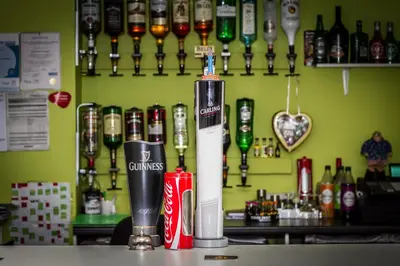 a bar with a drink dispenser on a counter at New Promenade Hotel in Blackpool