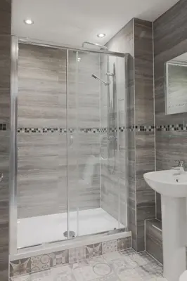 a bathroom with a shower and a sink at The Glebe Hotel in Liverpool