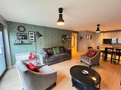 a living room with a couch and a table at Centrally located apartment in Duke Street- free parking- two bathrooms in Liverpool