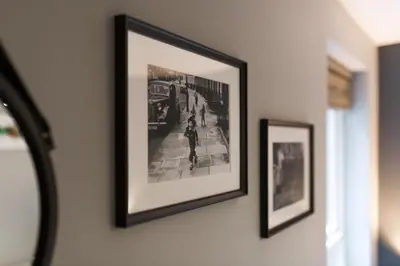 a picture on a wall with two pictures on it at Centrally located apartment in Duke Street- free parking- two bathrooms in Liverpool