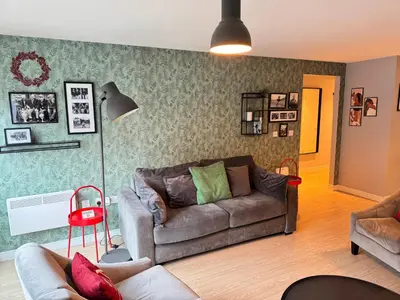 a living room with a couch and a lamp at Centrally located apartment in Duke Street- free parking- two bathrooms in Liverpool