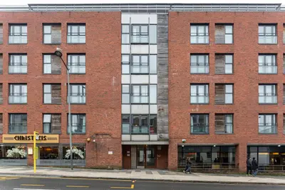 a brick building on the corner of a street at Centrally located apartment in Duke Street- free parking- two bathrooms in Liverpool