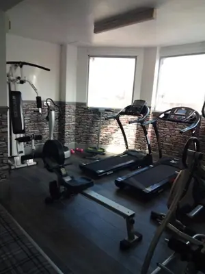 a gym with several exercise bikes in a room at Victoria House in Barrow in Furness