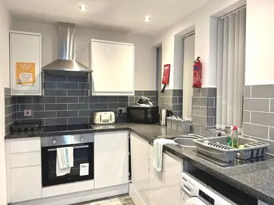 a kitchen with a sink and a stove at Winter Gardens Service Apartments 2 by Blackpool Service Apartments in Blackpool