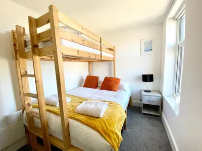 a bedroom with a bunk bed with a ladder at Winter Gardens Service Apartments by Blackpool Service Apartments in Blackpool