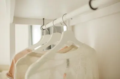 a white wedding dress hanging on a rack at Sapphire Home Stay in Liverpool