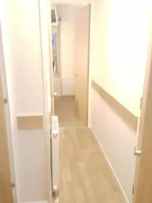 a hallway with a door leading into a room at Rydal 38 Haven lakeland LA11 7LT in Flookburgh
