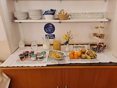 a table with fruits and other food on it at Somerset House B&B in Grange Over Sands