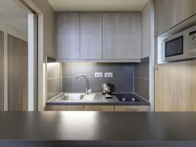 a kitchen with a sink and a microwave at Aparthotel Adagio Liverpool City Centre in Liverpool