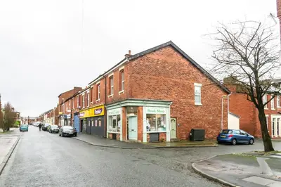 a brick building on the side of a street at Bedzzz - Booklovers Dream in Preston
