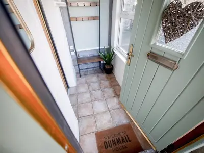 an overhead view of a hallway with a door at Dunmail House in Grange Over Sands
