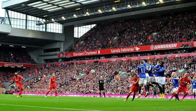 a group of people playing soccer in a stadium at Comfortable Liverpool Townhouse - Close to City & Stadium in Liverpool