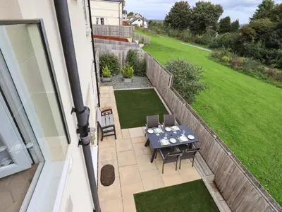 an aerial view of a patio with a table and chairs at Shore View in Grange Over Sands