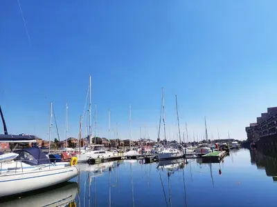 a bunch of boats are docked in a harbor at The Joker Boat in Liverpool
