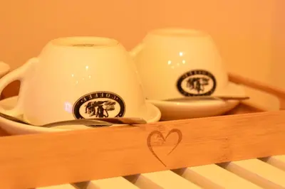 two tea cups sitting on top of a keyboard at Aparthotel Glovers Court in Preston