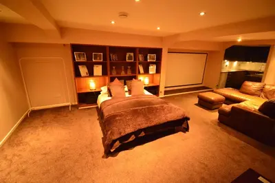 a large bedroom with a bed and a couch at Aparthotel Glovers Court in Preston