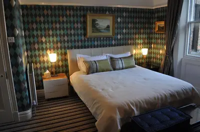 a bedroom with a large bed in a room at Aberley House in Liverpool