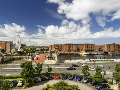 a parking lot with cars parked in a city at ibis Liverpool Centre Albert Dock – Liverpool One in Liverpool