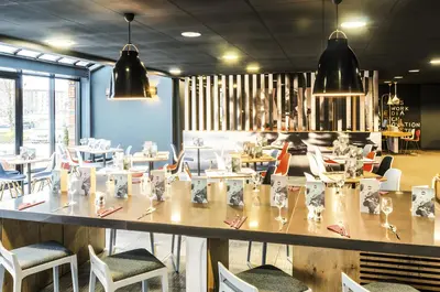 a dining room with a large table and chairs at ibis Liverpool Centre Albert Dock – Liverpool One in Liverpool
