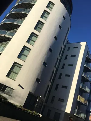 a tall white building with windows at Ropewalks Apartments by Happy Days in Liverpool