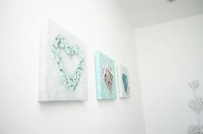 two paintings of a heart on a wall at Ropewalks Apartments by Happy Days in Liverpool
