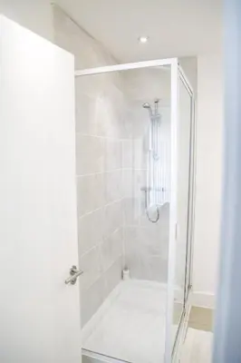 a shower with a glass door in a bathroom at Ropewalks Apartments by Happy Days in Liverpool